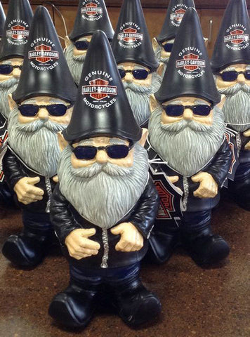 Biker gnome wearing a leather jacket and riding a motorcycle.