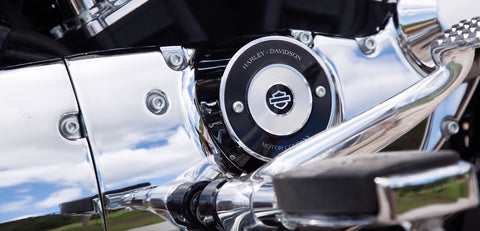 Harley Davidson Sportster Superlow 1200T touring cruiser with mid-rise handlebars, dual saddlebags, and chrome details